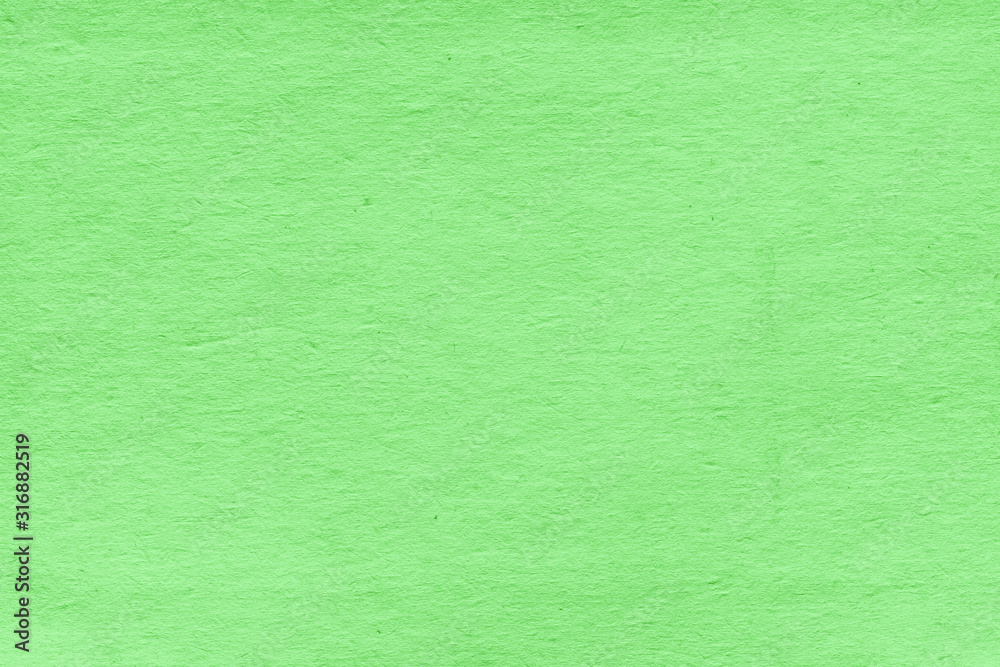 Fototapeta premium Cardboard green abstract pattern texture close-up. Retro old paper background. Grunge concrete wall. Vintage blank wallpaper.