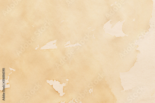 Vintage and old looking coffee cup stain background. Painted with a tea retro texture. Grunge paper for drawing. Ancient book page.