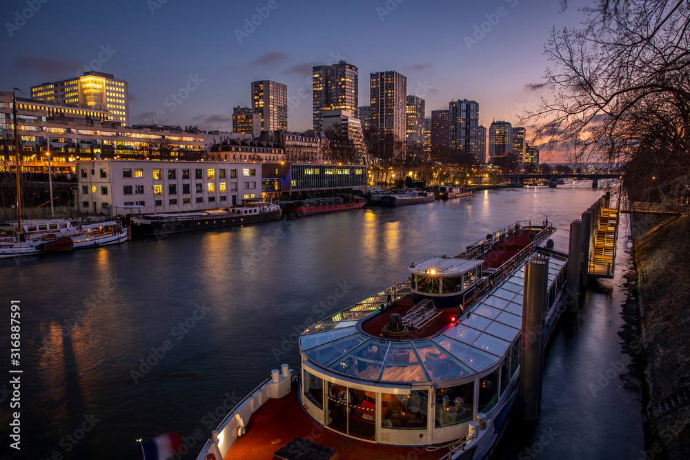 Paris, France - January 20, 2020: Twilight view of the Beaugrenelle quarter and the Seine river