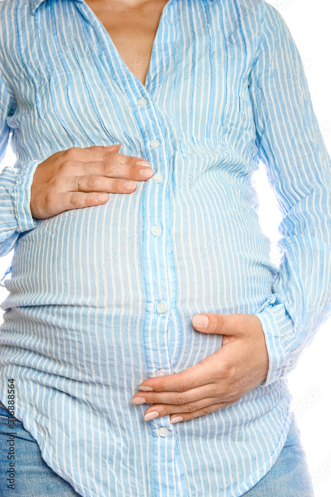 Happy pregnant girl lies on white background Happy pregnant girl lies on white background