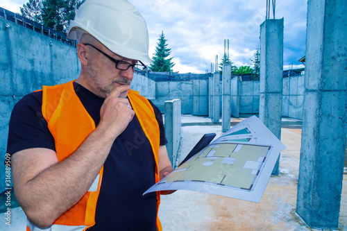 Build. Man in a helmet at a...