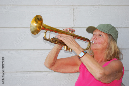 Mature female trumpet player.