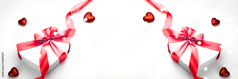 Valentines day red ribbon White heart shaped gift box with bow for valentine day, birthday, mothers day. Flat lay. Symbol of love. Valentines day red ribbon White heart shaped gift box with bow for valentine day, birthday, mothers day. Flat lay. Symbol of love.