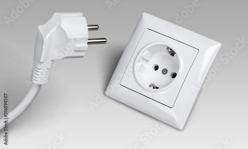 Obraz na plátně White electrical plug and the electric socket