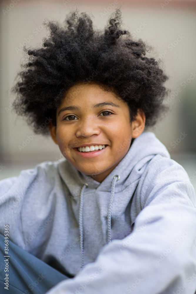 Young mixed race teenage boy looking at the camera. Young mixed race teenage boy looking at the camera.