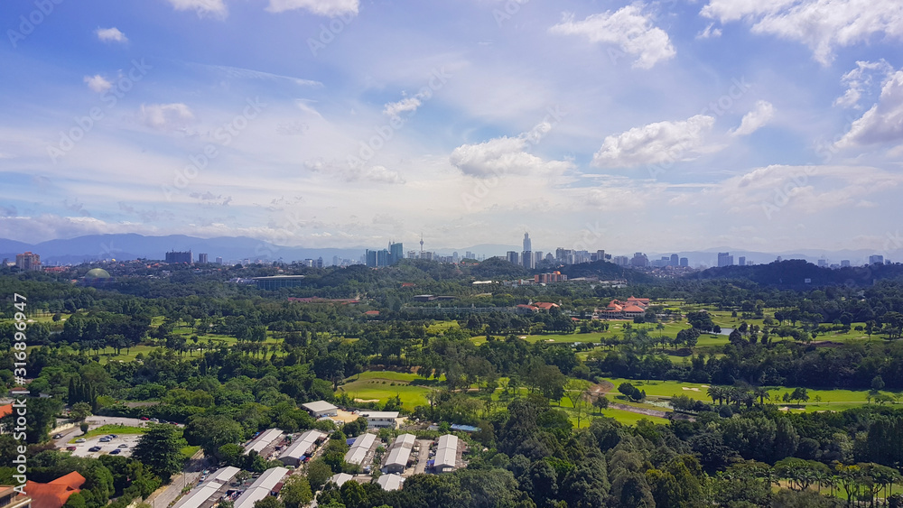 Blue color sky over green landscape at Kuala Lumpur, Malaysia