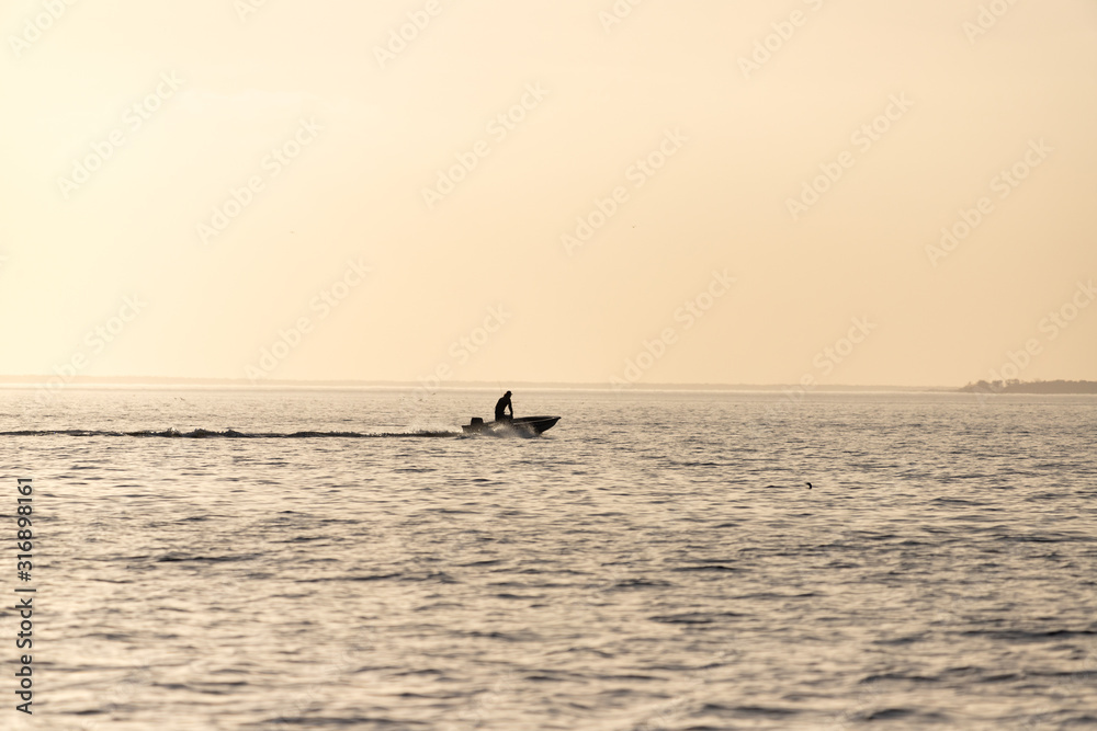 Fishing Boat Returning Home at Sunset in Oriental, North Carolina