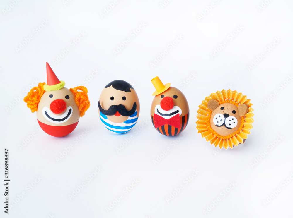 Fototapeta premium Easter circus. Egg with a funny face.