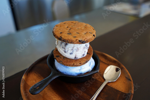 Photography Cookies and cream Ice cream sandwich served on wooden plate
