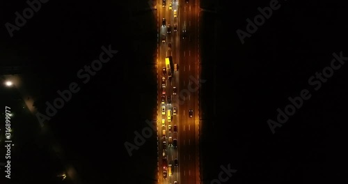 4K Aerial Top Drone View: Accident and traffic jam on the bridge in the evening after a working day. A huge number of cars on the road at rush hour. Downtown, city central part. Dnipro, Ukraine
