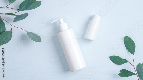 Cosmetics SPA branding mockup. Clear shampoo bottle and essential oil container branding mockups. Natural organic beauty product concept, Flat lay minimalist style composition, top view