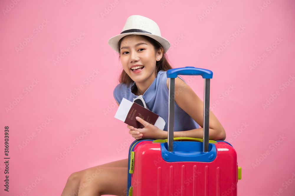 Tourist woman in summer casual clothes.Asian Smiling woman .Passenger traveling abroad to travel on colour background.Asian woman going to summer vacation.Travel trip funny. Tourist woman in summer casual clothes.Asian Smiling woman .Passenger traveling abroad to travel on colour background.Asian woman going to summer vacation.Travel trip funny.