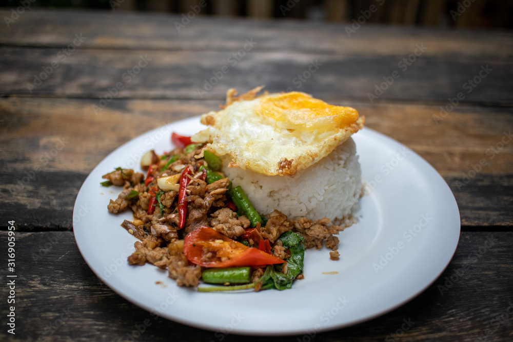Rice topped with stir-fried beef and basil