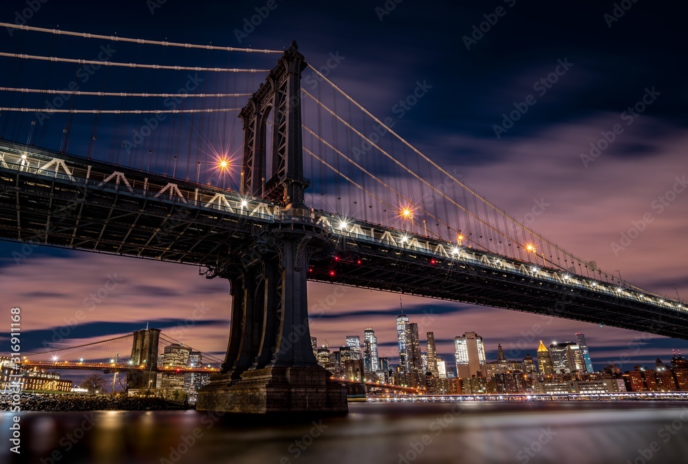 Beautiful cityscape with a suspension bridge and buildings in Main Street Park New York, USA