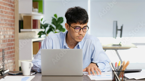Photography Asian man at office, Young asia businessman concentrate on paper work while work