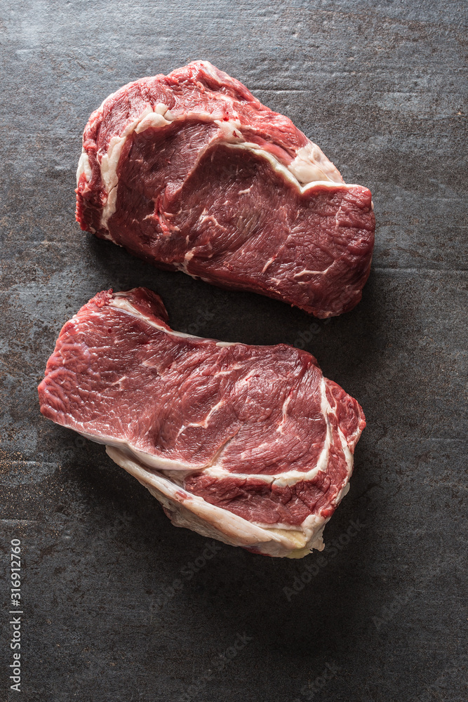 Beef Rib Eye steak on slate board - Top of view