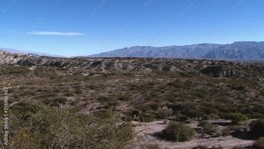 Andes Pre-Mountain Range and Dirt Road in Catamarca province, Argentina. Panoramic Shot. Andes Pre-Mountain Range and Dirt Road in Catamarca province, Argentina. Panoramic Shot.