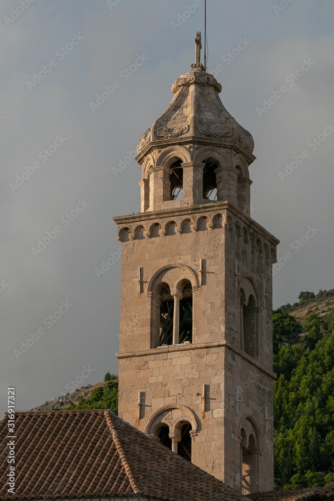 Saint Dominic Church bell tower and red roofs of the Dominican Monastery in old town Dubrovnik, Croatia 