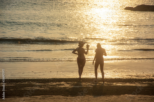 Tourists standing to take pictures at Khao Klak Beach on March 29,2018 in Phangnga,Thailand.