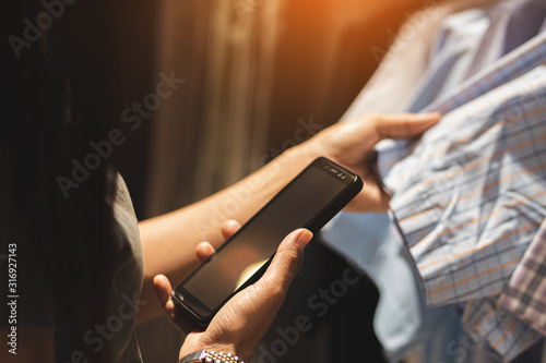woman using smartphone working playing with happy.