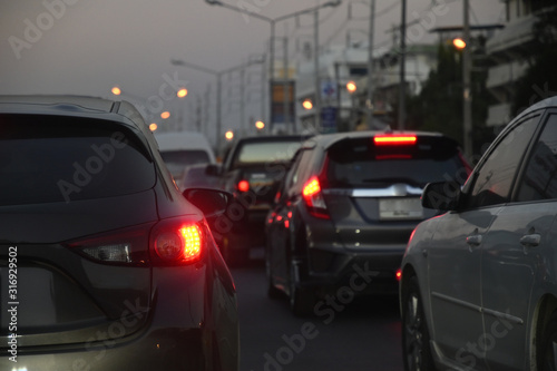 traffic jam on night road, car driving in rush hour of city life