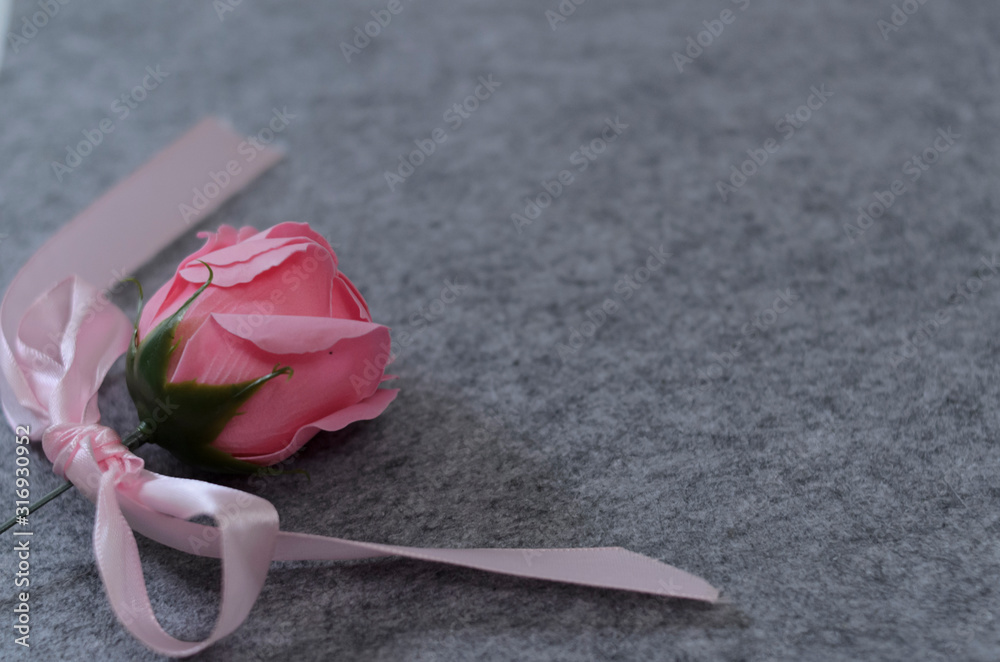 Floral composition with a pink roses and red heart on grey background. Valentine's Day background. Flat lay, top view. Floral composition with a pink roses and red heart on grey background. Valentine's Day background. Flat lay, top view.