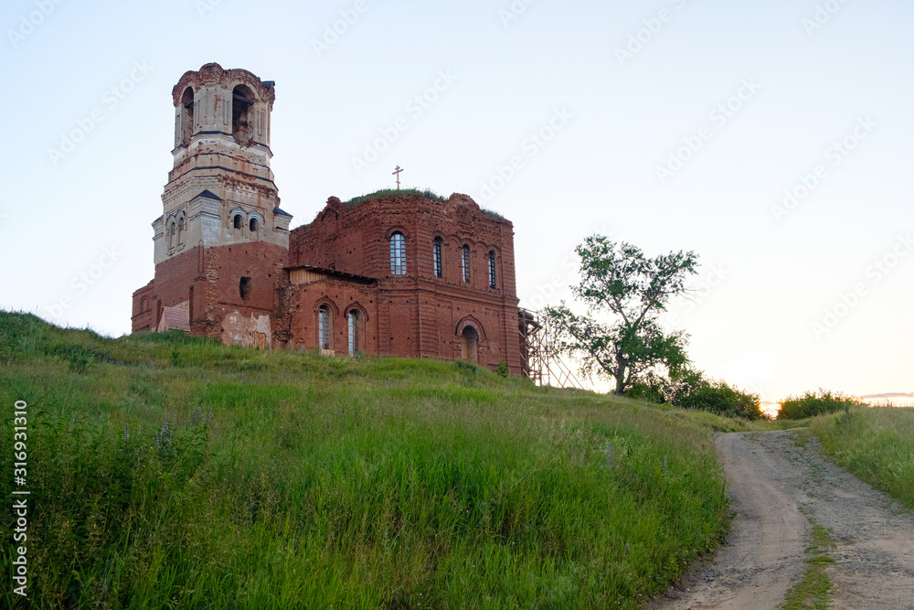 an old abandoned Church on a mountain nearby goes up the road