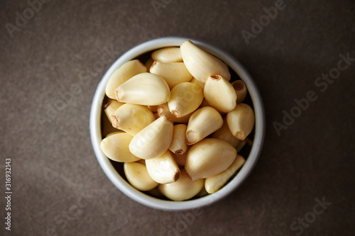 Peeled garlic background, studio shot 