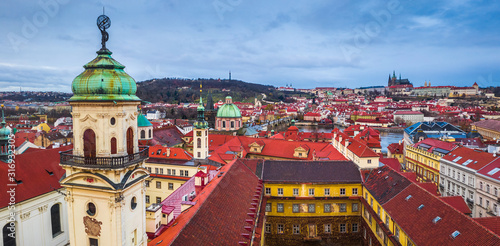Prague, Czech Republic - Panoramic view of Prague with the tower of the baroque library (Klementinum), the famous Charles Bridge, St. Francis Of Assisi Church and St. Vitus Cathedral at background