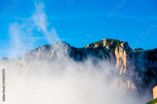 BARCELONA, SPAIN - December 26, 2018: The mountains of Montserrat in Barcelona, Spain. Montserrat  is a Spanish shaped mountain which influenced Antoni Gaudi to make his art works. © J Photography