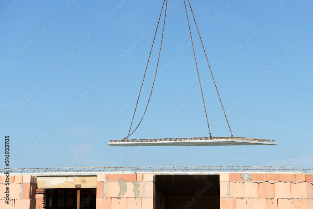 Precast Floor Slab flies through the air in front of bue sky Precast Floor Slab flies through the air in front of bue sky