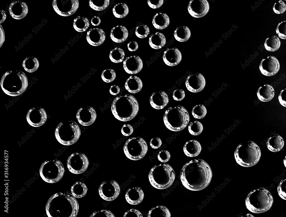 Air balls in water on a black background Air balls in water on a black background