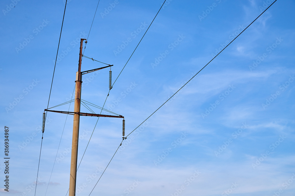 Electric power lines and wires with blue sky. Support of power lines in a nice day Electric power lines and wires with blue sky. Support of power lines in a nice day