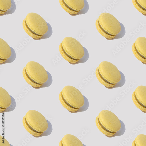 Pattern with yellow macaroons in abstract style on white background. Magic su...