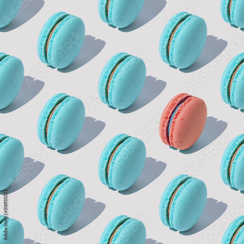 Abstract pattern with blue and pink macaroons on white background with shadow...