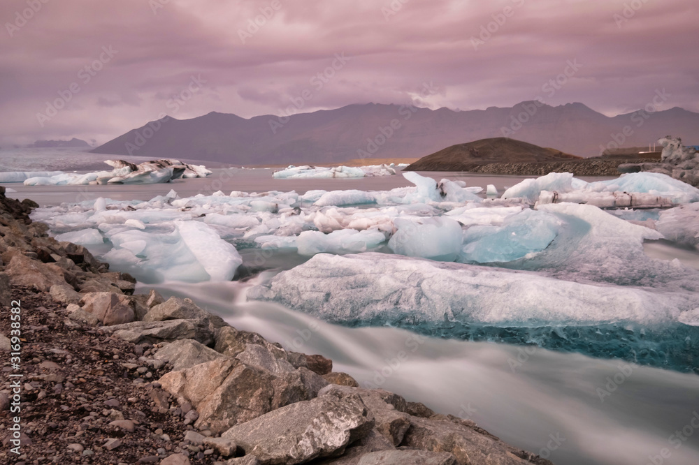 Obraz premium Jokulsarlon glacier lagoon in Iceland. Long exposure shot makes the water and the sky silky. Long exposure, glacier, moody concepts