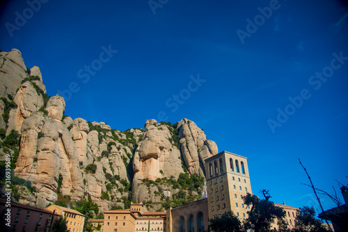 BARCELONA, SPAIN - December 26, 2018: The mountains and buildings of Montserrat in Barcelona, Spain. Montserrat is a Spanish shaped mountain which influenced Antoni Gaudi to make his art works.
