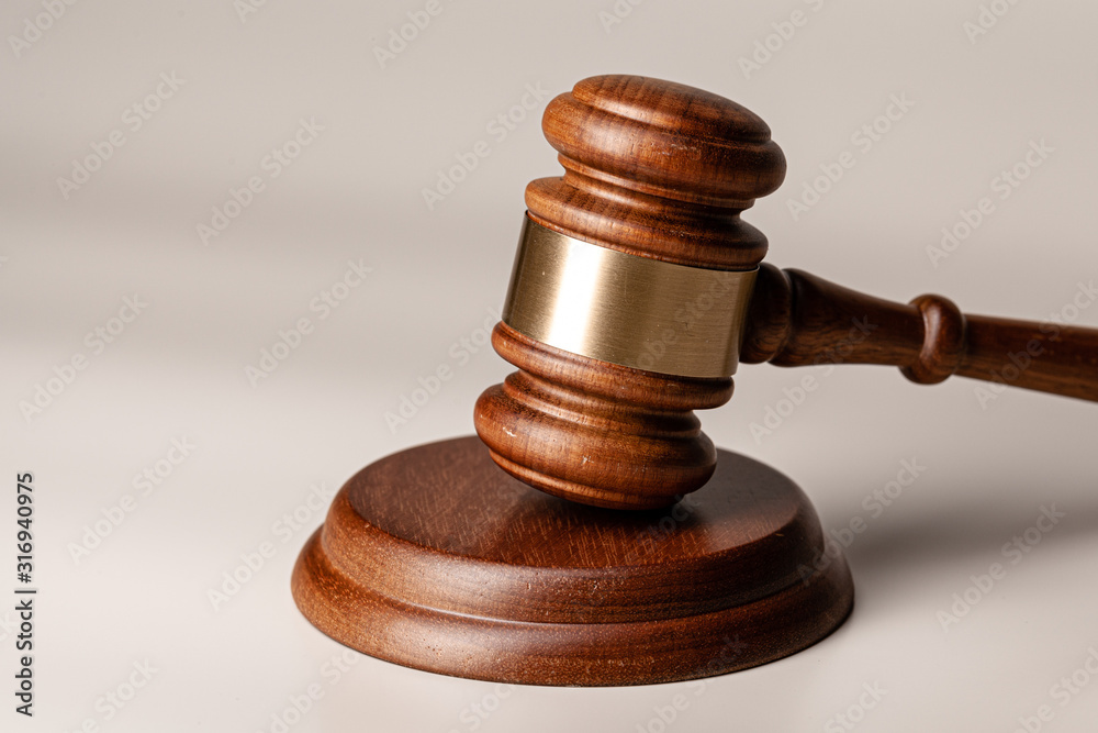 Wooden judges gavel on table close up
