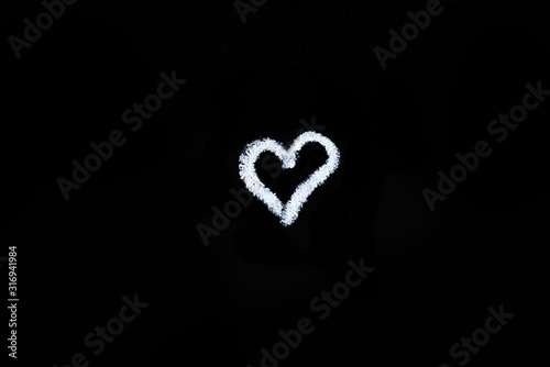 hand drawn heart with arrow on black chalk board. copy space. valentines day, all lovers concept