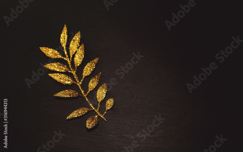 Gold flower isolated on black background