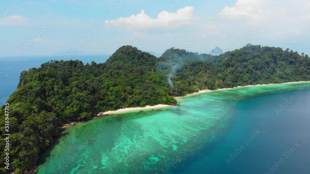 The Stunning Scenery Of White Sand Beach In Thailand Composed Of Glorious Trees and Blue Calm Ocean - Aerial Shot The Stunning Scenery Of White Sand Beach In Thailand Composed Of Glorious Trees and Blue Calm Ocean - Aerial Shot