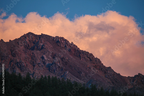 Bright sunset, rocky peak in red, natural backgrounds