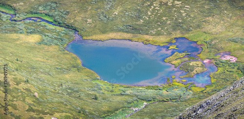 Top view of the lake, summer landscape, mountain tundra. Natural background.