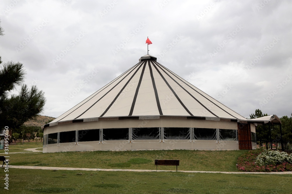 A very large tent made of thick cloth A very large tent made of thick cloth