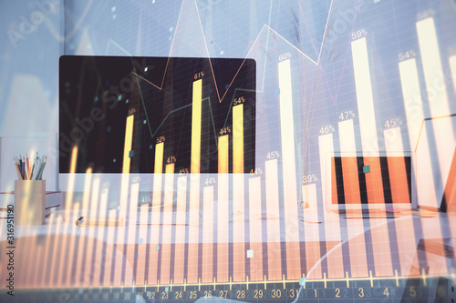 Forex graph hologram on table with computer background. Multi exposure. Concept of financial markets.