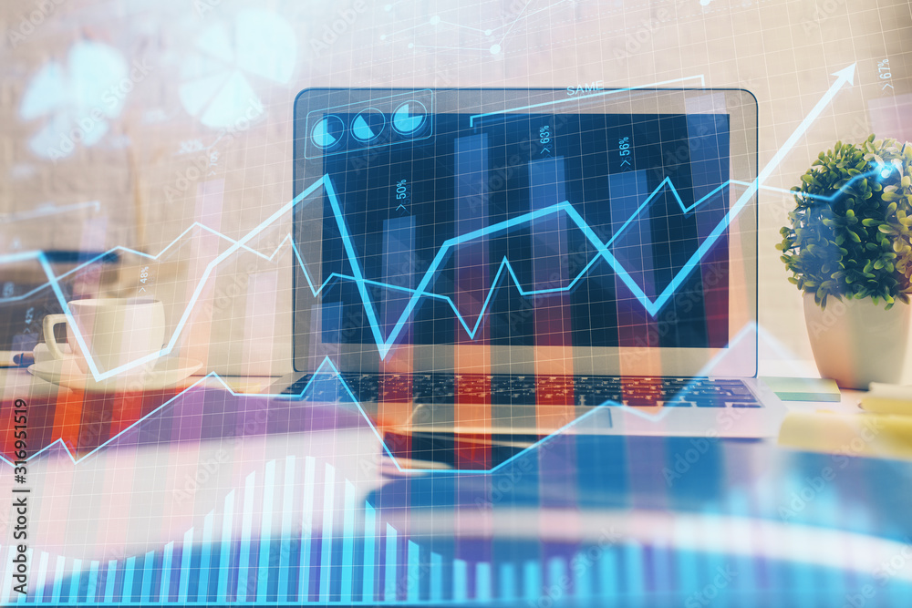Financial graph colorful drawing and table with computer on background. Multi exposure. Concept of international markets. Financial graph colorful drawing and table with computer on background. Multi exposure. Concept of international markets.