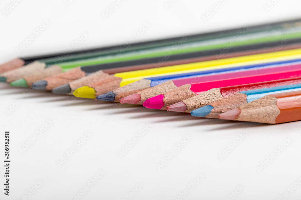 close up macro shot of colorful pencils on white background close up macro shot of colorful pencils on white background