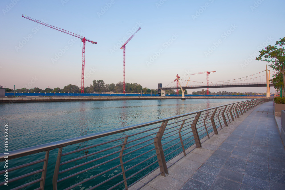 silhouette of construction cranes, industrial photo. Dubai, UAE