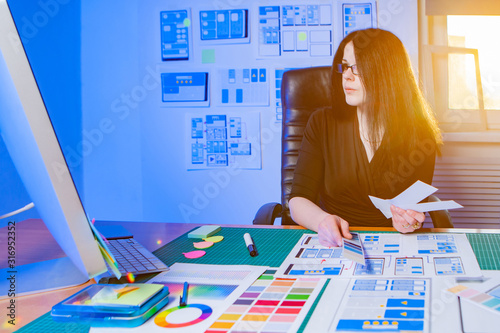 Woman working on mobile app...