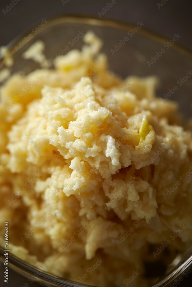Crushed garlic in plastic bowl Crushed garlic in plastic bowl